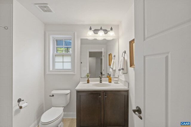 125 Highland Cir, Zion Crossroads, VA 22942 - full bath featuring toilet, vanity, visible vents, tile patterned flooring, and baseboards