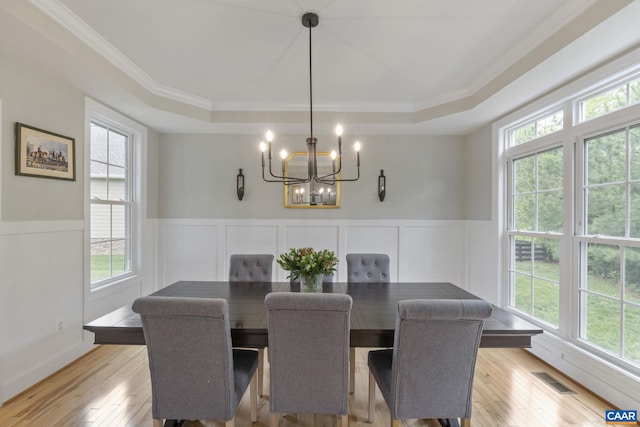 125 Highland Cir, Zion Crossroads, VA 22942 - dining room with light wood finished floors, an inviting chandelier, plenty of natural light, and a raised ceiling