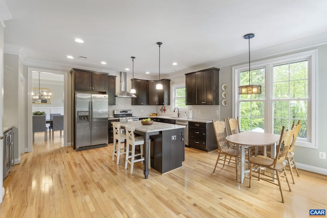 125 Highland Cir, Zion Crossroads, VA 22942 - kitchen featuring wall chimney range hood, crown molding, stainless steel appliances, and a sink