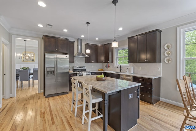 125 Highland Cir, Zion Crossroads, VA 22942 - kitchen with visible vents, wall chimney exhaust hood, dark brown cabinetry, crown molding, and appliances with stainless steel finishes