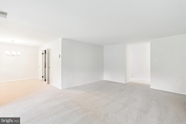 18707 Walkers Choice Rd Unit 6, Gaithersburg, MD 20886 - spare room featuring a chandelier, light carpet, and baseboards