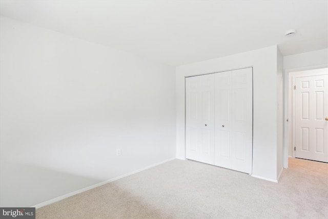18707 Walkers Choice Rd Unit 6, Gaithersburg, MD 20886 - unfurnished bedroom featuring light carpet, baseboards, and a closet