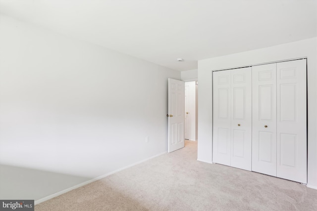 18707 Walkers Choice Rd Unit 6, Gaithersburg, MD 20886 - unfurnished bedroom featuring light carpet, baseboards, and a closet