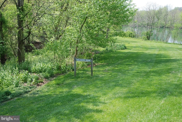 18707 Walkers Choice Rd Unit 6, Gaithersburg, MD 20886 - view of green lawn featuring a forest view and a water view