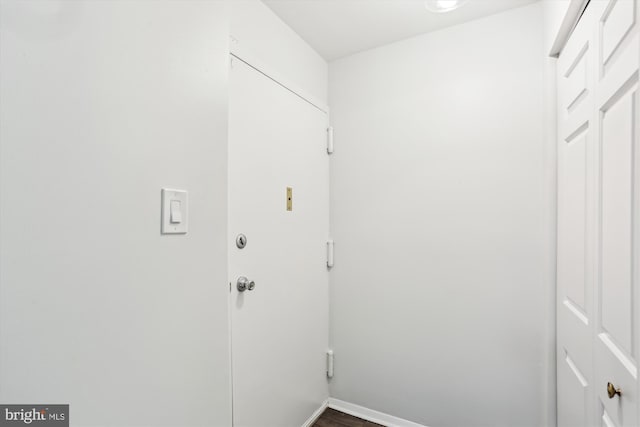 18707 Walkers Choice Rd Unit 6, Gaithersburg, MD 20886 - laundry room with wood finished floors and baseboards