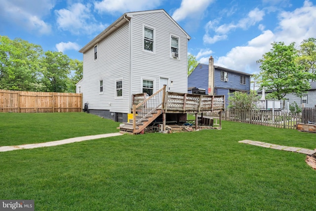 rear view of house featuring a deck and stairs