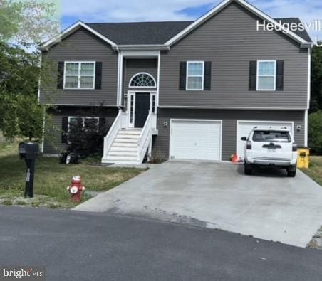 108 Irwin Ct, Hedgesville, WV 25427 - bi-level home with concrete driveway and an attached garage