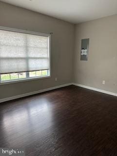 108 Irwin Ct, Hedgesville, WV 25427 - empty room featuring dark wood-type flooring and baseboards