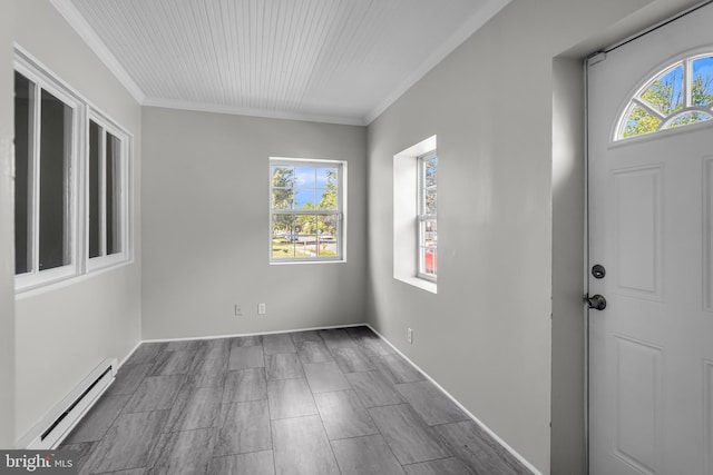 foyer featuring baseboard heating, healthy amount of natural light, and crown molding