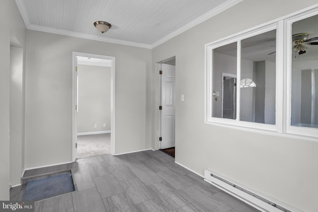unfurnished room featuring a baseboard heating unit, ceiling fan, crown molding, and baseboards