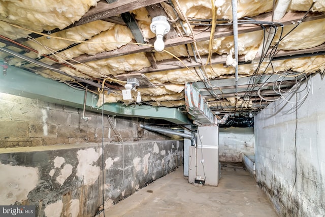 unfinished basement with heating unit