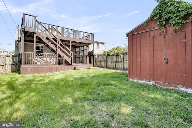 view of yard with stairs and a deck