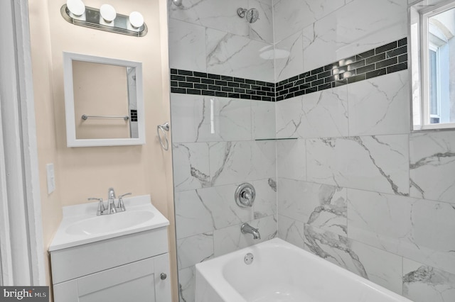 bathroom featuring tub / shower combination and vanity