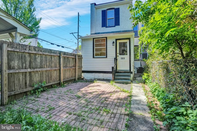 view of outdoor structure with a fenced backyard and entry steps