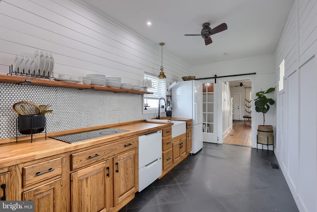 kitchen with wooden counters, open shelves, a ceiling fan, white appliances, and a barn door