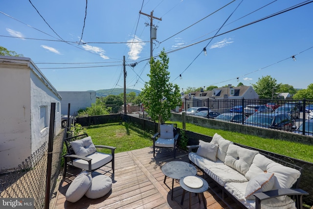 wooden deck featuring an outdoor living space