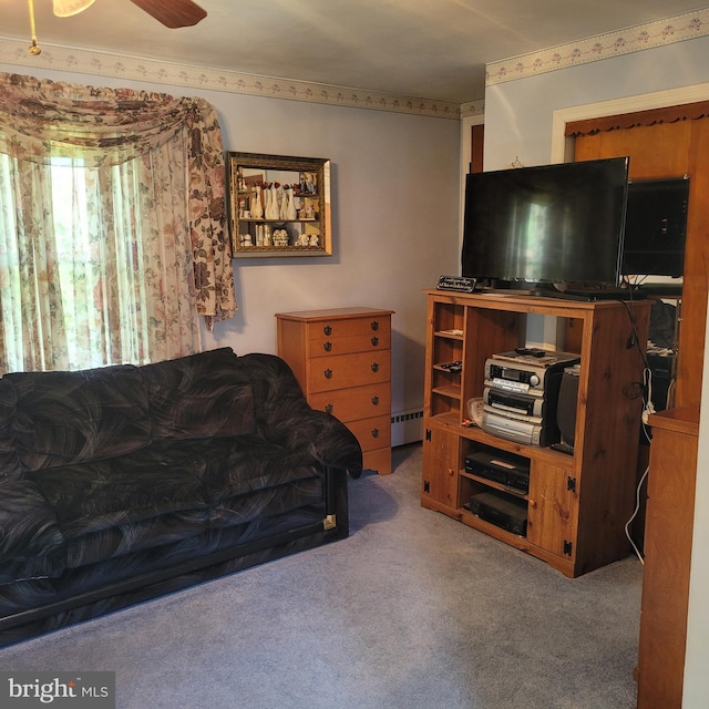carpeted living room with a baseboard radiator and ceiling fan