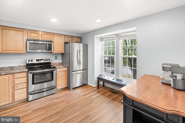 6436 Rockledge Ct, Elkridge, MD 21075 - kitchen with stainless steel appliances, light wood-style floors, light brown cabinets, and recessed lighting