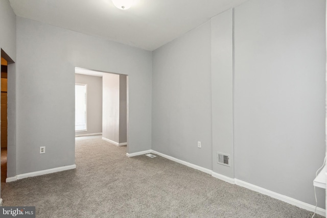 908 Mckean Ave, Baltimore, MD 21217 - empty room with carpet floors, baseboards, and visible vents