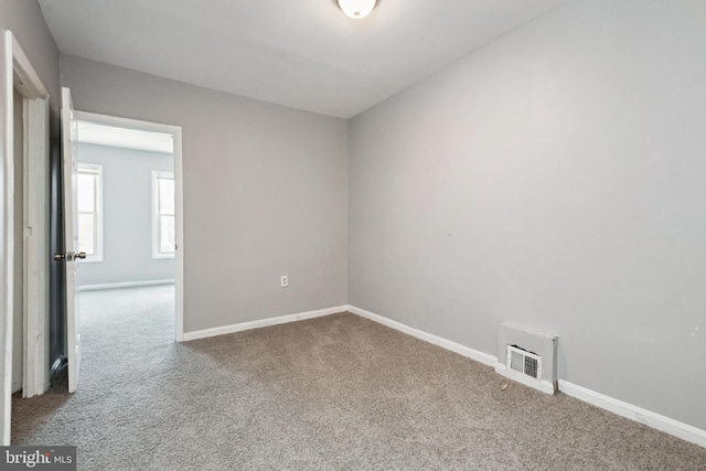 908 Mckean Ave, Baltimore, MD 21217 - carpeted empty room featuring baseboards and visible vents