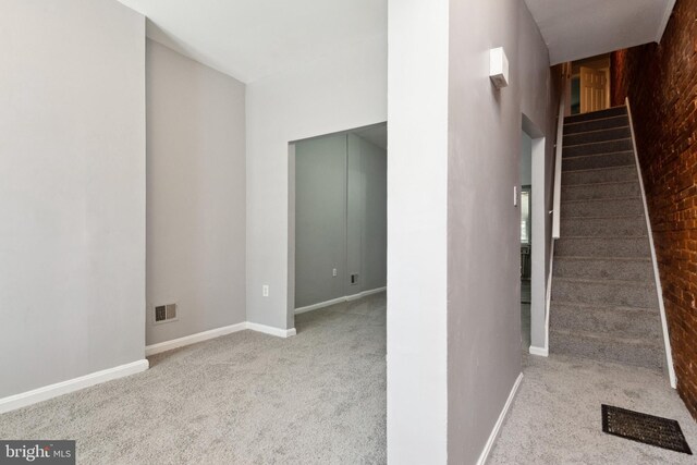 908 Mckean Ave, Baltimore, MD 21217 - stairs with carpet, baseboards, and visible vents