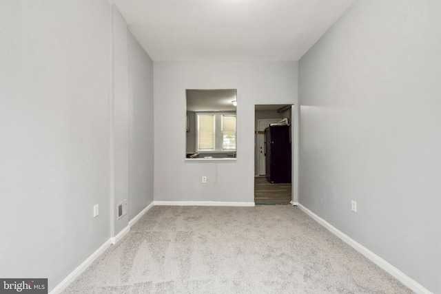908 Mckean Ave, Baltimore, MD 21217 - unfurnished room with carpet flooring and baseboards