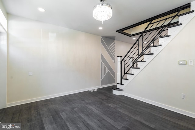 staircase with baseboards, a chandelier, recessed lighting, and wood finished floors
