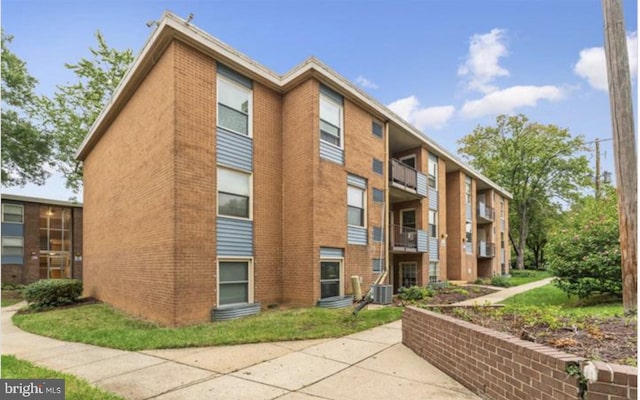 3841 Saint Barnabas Rd Unit 3843T, Suitland, MD 20746 - view of building exterior featuring central AC
