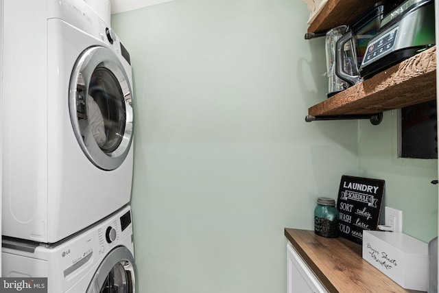 laundry area with stacked washer / dryer