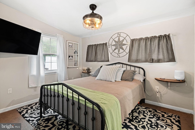 bedroom featuring baseboards