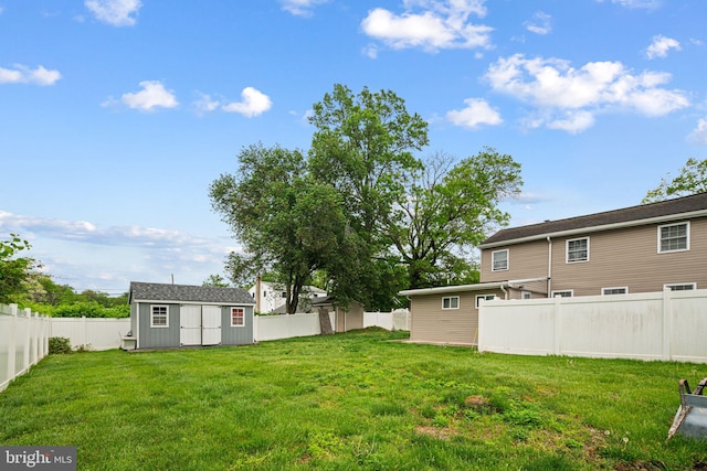 view of yard with a storage unit and an outbuilding