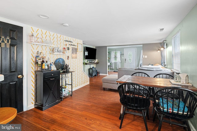 dining room with wood finished floors and baseboards
