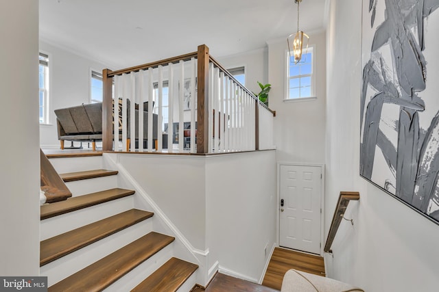 5992 Passend Dr, Frederick, MD 21703 - stairway featuring wood finished floors and a chandelier