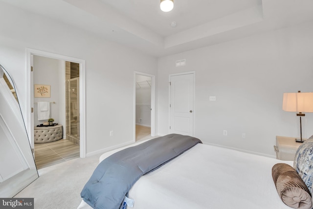 5992 Passend Dr, Frederick, MD 21703 - carpeted bedroom with a spacious closet, baseboards, and ensuite bath