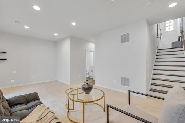 5992 Passend Dr, Frederick, MD 21703 - living area featuring light colored carpet, recessed lighting, stairway, and baseboards
