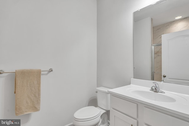 5992 Passend Dr, Frederick, MD 21703 - bathroom featuring toilet, baseboards, vanity, and an enclosed shower