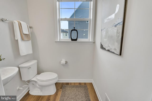 5992 Passend Dr, Frederick, MD 21703 - half bathroom with baseboards, wood finished floors, and toilet