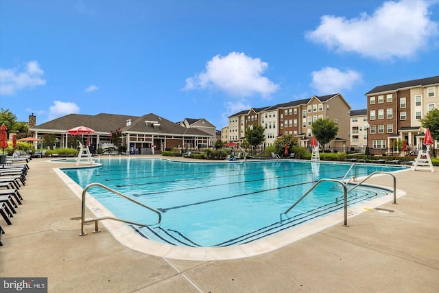 5992 Passend Dr, Frederick, MD 21703 - community pool featuring a patio, a residential view, and fence
