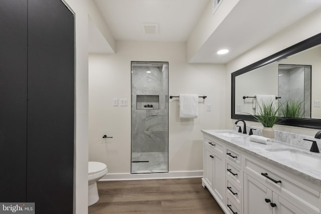 1806 Crofton Pkwy, Crofton, MD 21114 - bathroom with double vanity, wood finished floors, and a marble finish shower