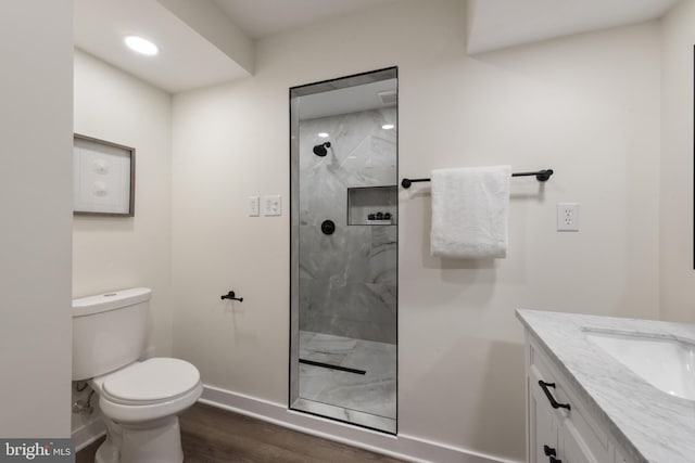 1806 Crofton Pkwy, Crofton, MD 21114 - bathroom featuring wood finished floors, a marble finish shower, and vanity