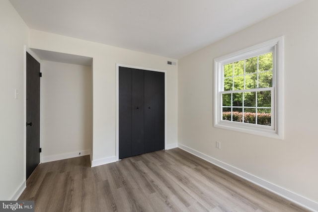 1806 Crofton Pkwy, Crofton, MD 21114 - unfurnished bedroom featuring wood finished floors and a closet