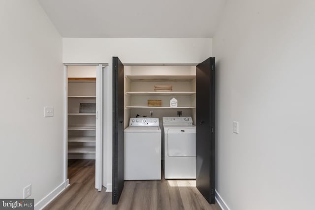 1806 Crofton Pkwy, Crofton, MD 21114 - washroom with wood finished floors and washer and dryer