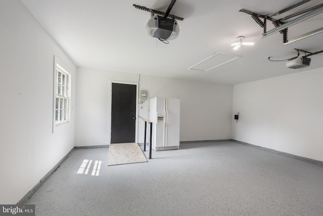 1806 Crofton Pkwy, Crofton, MD 21114 - garage with a garage door opener and white refrigerator with ice dispenser