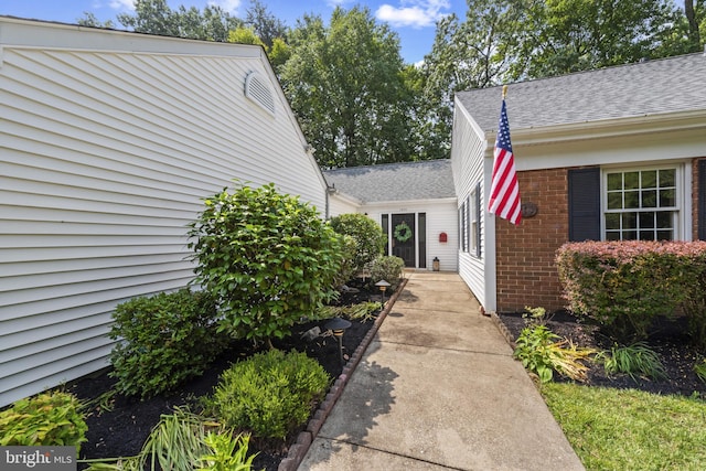 1806 Crofton Pkwy, Crofton, MD 21114 - doorway to property featuring brick siding and roof with shingles