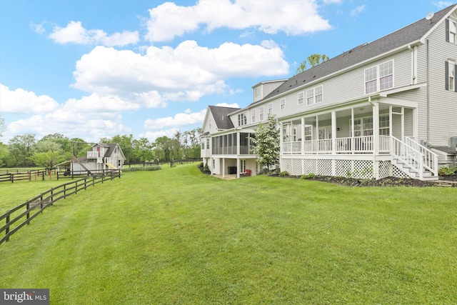 view of yard featuring a sunroom
