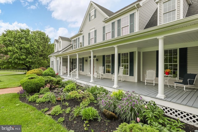 view of property exterior with covered porch