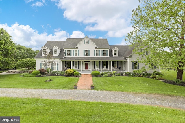view of front of home with a porch and a front yard