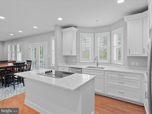kitchen with a sink, black electric cooktop, dishwasher, recessed lighting, and white cabinetry