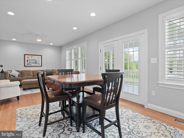 dining area with light wood-type flooring, recessed lighting, ceiling fan, and baseboards