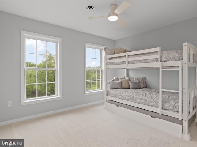 bedroom featuring baseboards and carpet flooring